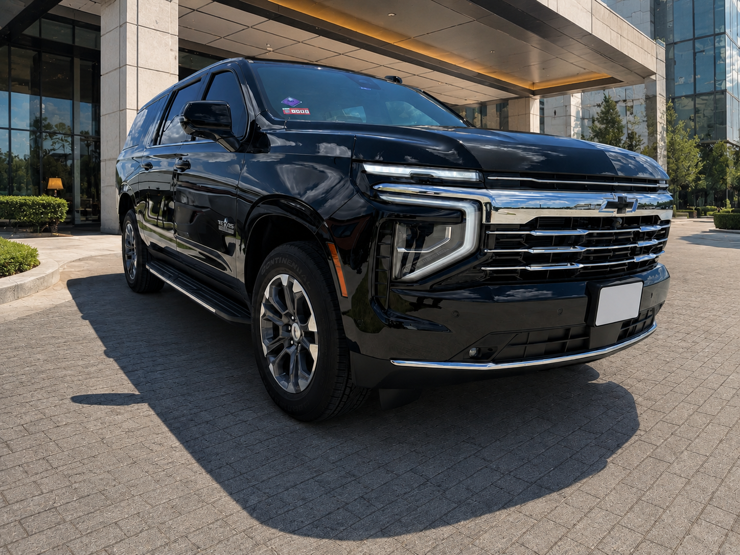 Euvico Executive 2026 Chevrolet Suburban at a luxury hotel entrance